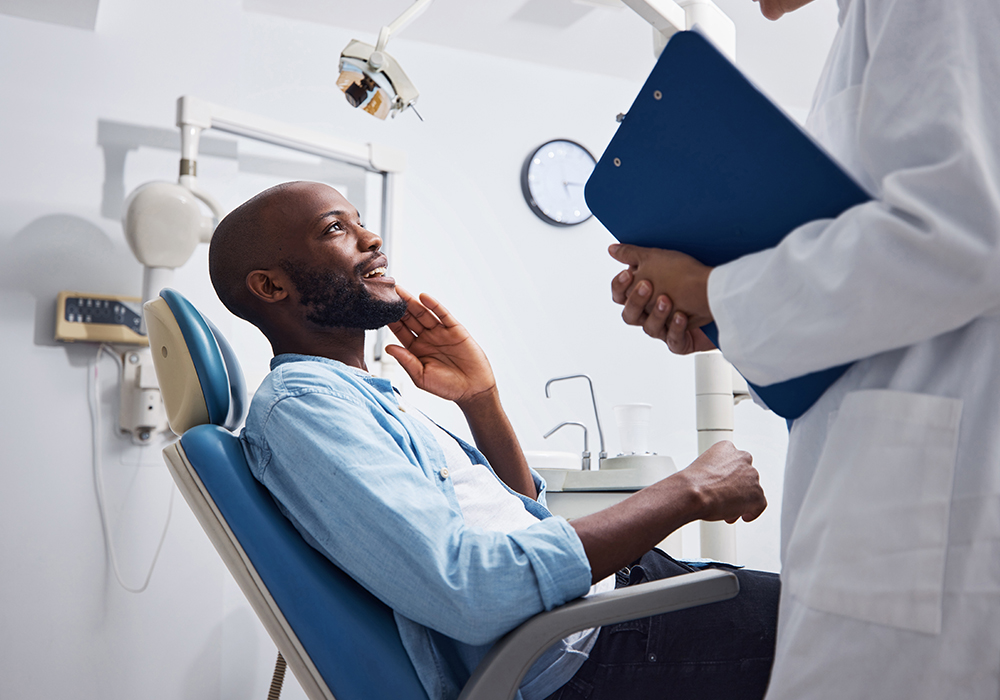 Man getting urgent dental care from dentist